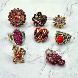 Set of 8 silver tone and pink rhinestone rings